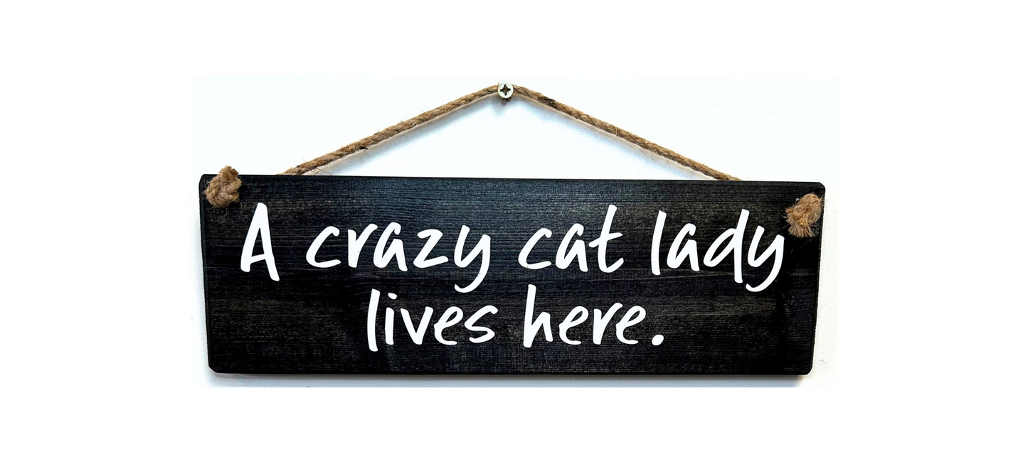 A Crazy Cat Lady Lives Here