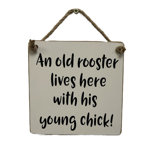 An old rooster and his young chick live here